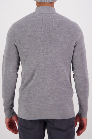 A person wearing a light gray Swanndri Otahu River Quarter Zip Merino Knit sweater and dark gray pants, shown from behind against a plain white background.
