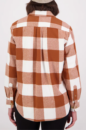 Someone is photographed from behind wearing the Swanndri Rapaki Long Sleeve Shacket in brown and white plaid, crafted from 100% brushed cotton, against a plain light background—an ideal winter layer.