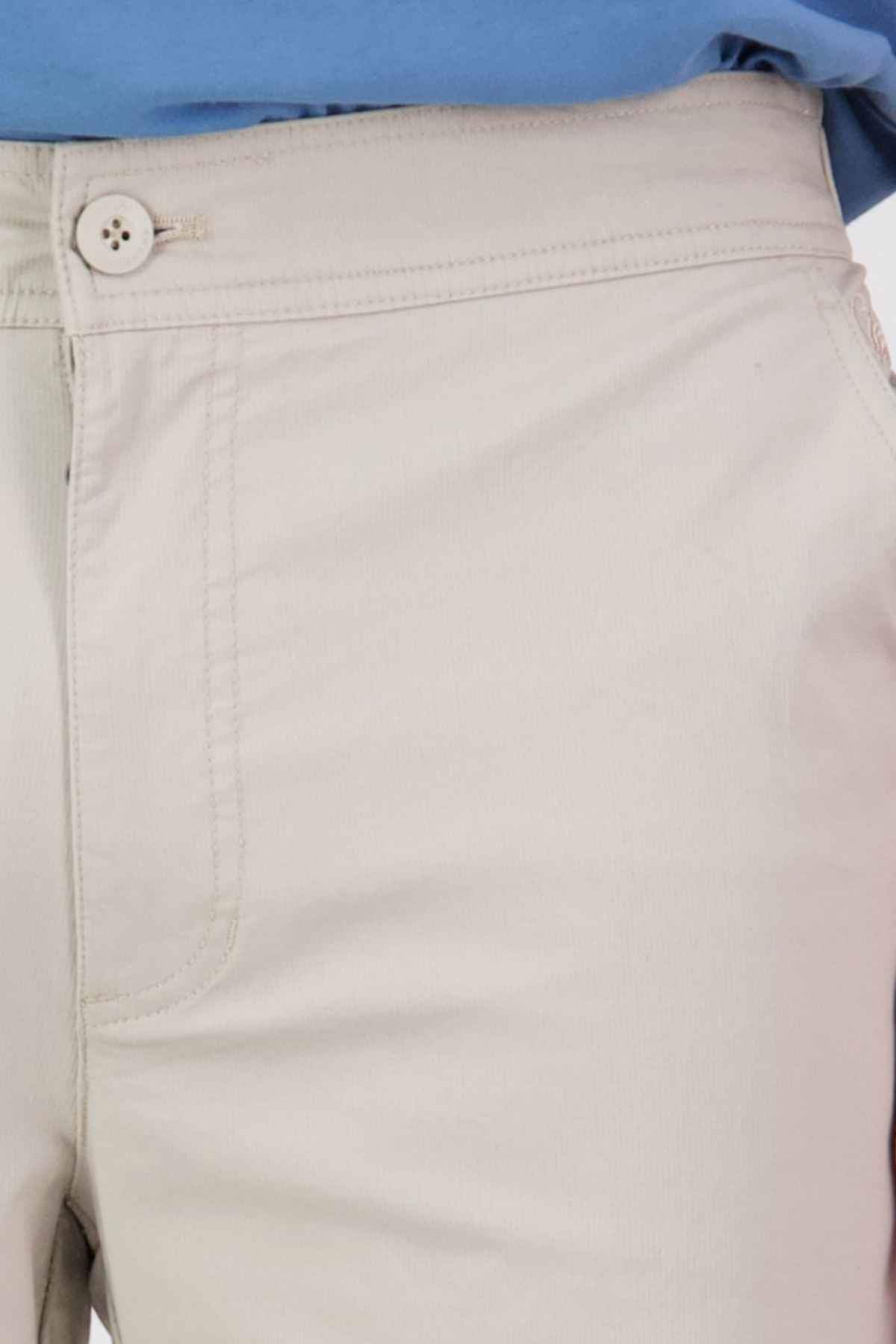 Close-up of a person wearing Swanndri Sandy Point Shorts, crafted from stretch cotton fabric with a button and zipper closure. A blue shirt is neatly tucked in, highlighting the waistband and part of the front pocket for an ideal blend of style and comfort.
