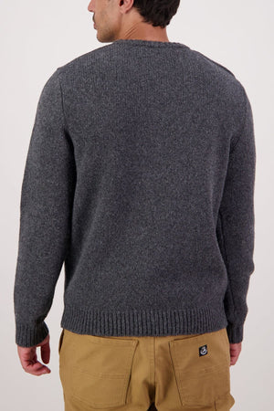 A person is shown from the back wearing a Swaandri Waylins Wool Knit Crew in grey with tan pants, set against a plain light background.