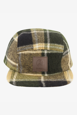 Front view of the Swanndri Wentworth Valley v2 Wool Cap in green, yellow, and black plaid, featuring a brown leather patch with logo and "Swannies" text on the front, plus an adjustable buckle at the back.