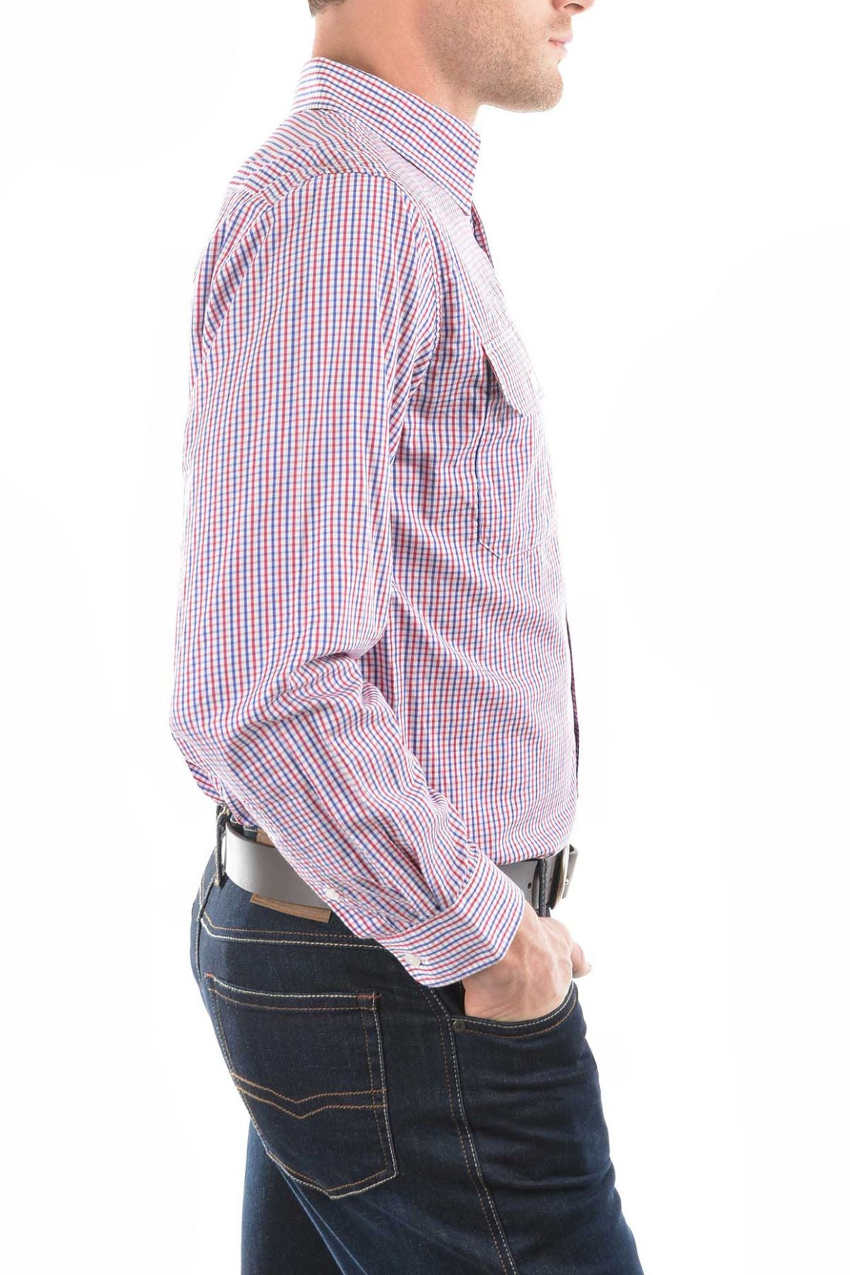 A man stands in profile with his hands in his pockets, wearing a Thomas Cook Wentworth Shirt made from 100% cotton in red, white, and blue, set against a white background.