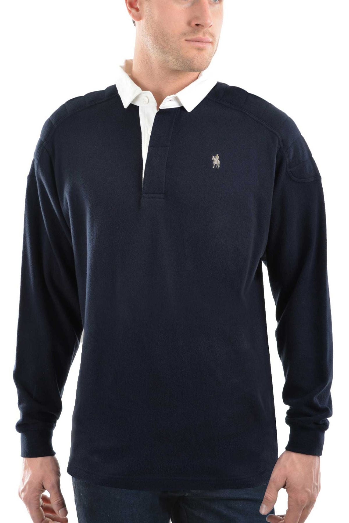 A man wears the Thomas Cook Bill Rugby—a navy blue long-sleeve shirt with a white collar, quilted shoulder panels, and a small embroidered logo—standing against a plain white background.