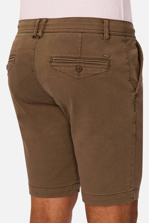 A man wearing Industrie The New Drifter Cuba Short, shown from behind, showcases details like belt loops, buttoned pockets, and a tailored fit—ideal for everyday wear.