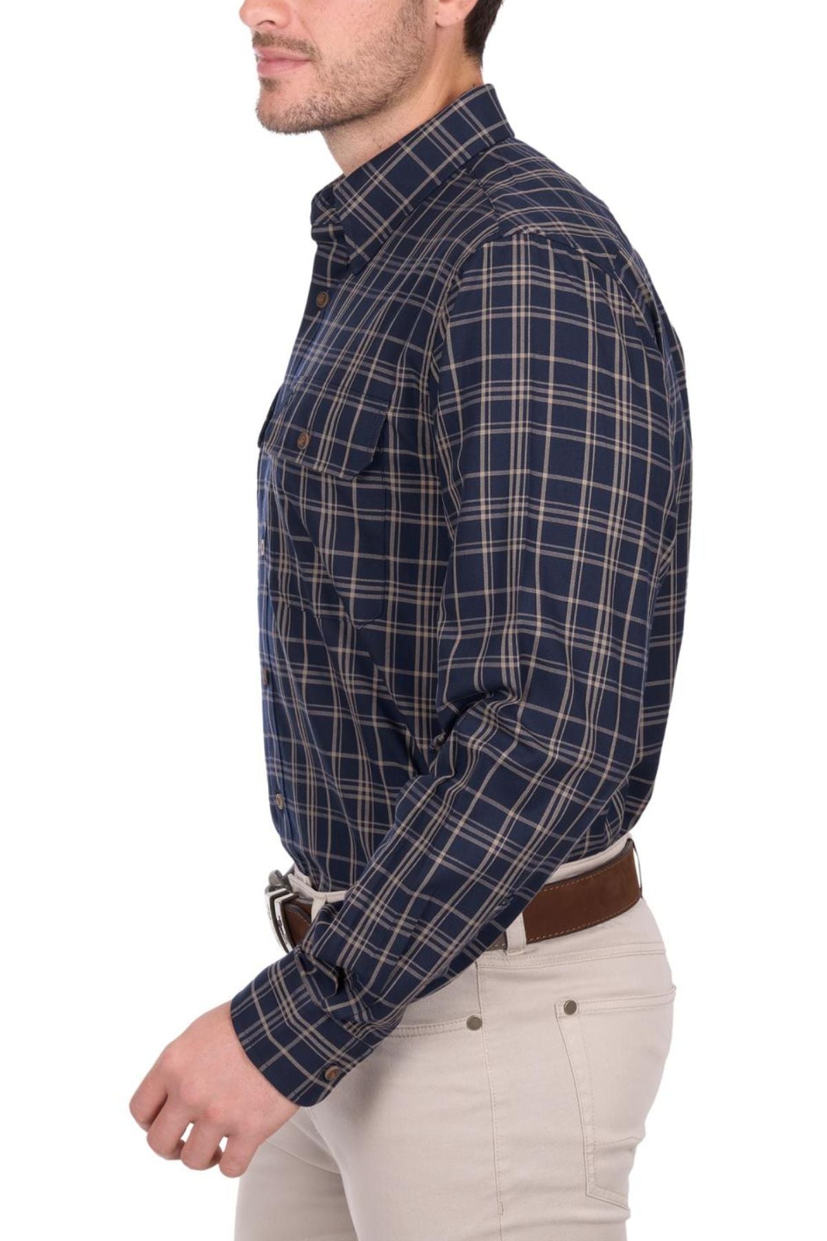 A man wearing a navy blue and beige plaid Thomas Cook Adam Shirt and light beige pants stands in profile against a white background.