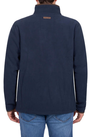 A person wearing a navy blue Thomas Cook Adrian Jacket and blue jeans, shown from the back against a white background.
