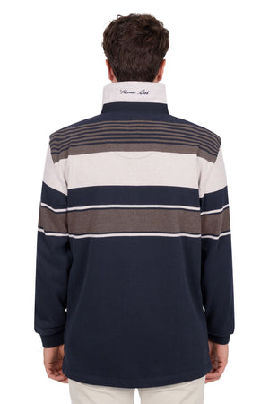A man with short brown hair is seen from behind wearing the Thomas Cook Bryan Stripe Rugby—a long-sleeve, collared pullover featuring navy, white, and brown horizontal stripes with an upturned collar showing embroidered text.