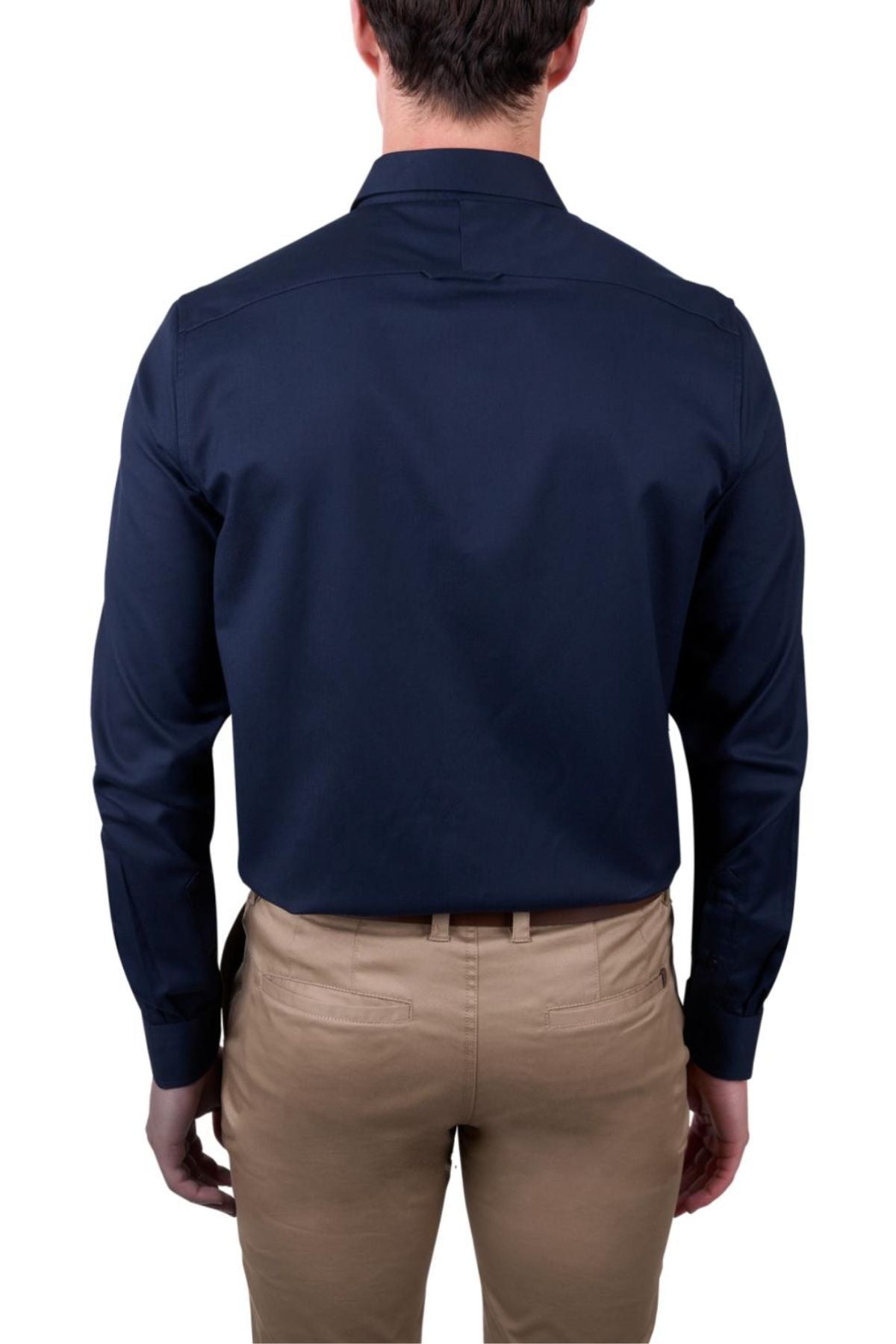 A man is seen from behind wearing a dark navy Thomas Cook Callum Tailored Shirt and light tan pants, with his arms relaxed at his sides against a plain white background.