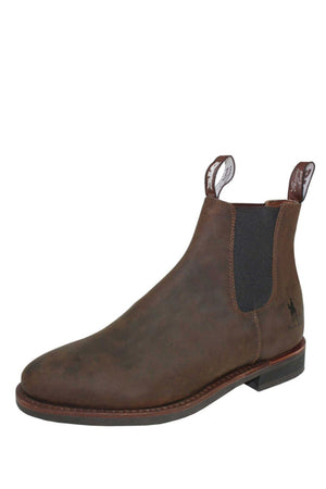 The Thomas Cook Duramax DTC Elastic Sided Boot features a brown leather upper, elastic side panels, pull tabs, a low heel, classic styling, subtle stitching, and a small horse logo near the heel.