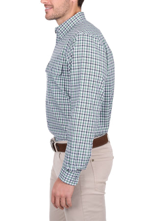 A man in profile wears the Thomas Cook Edward Shirt—green and white checkered, classic cotton long-sleeve workwear—with beige pants and a brown belt, posed against a white background.