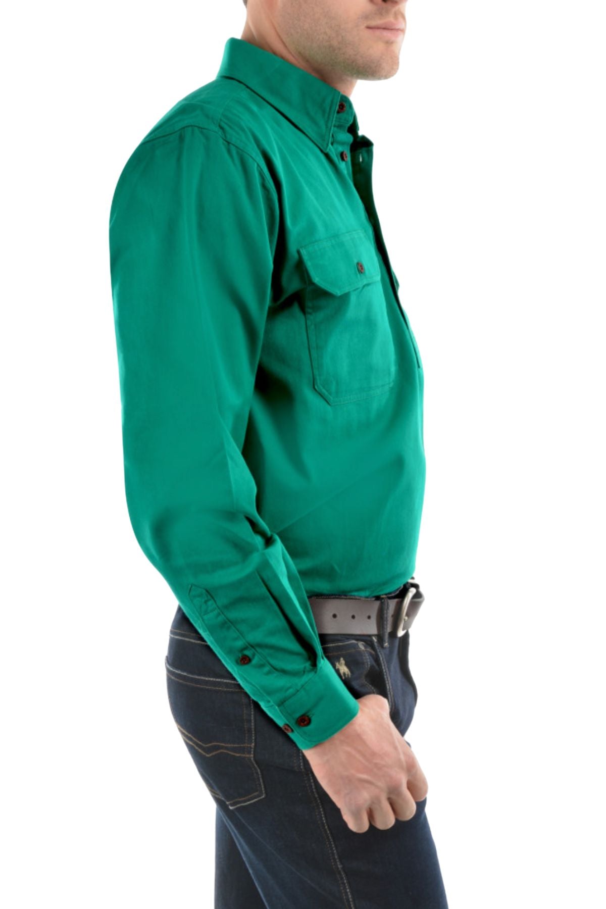 A man in a Thomas Cook Heavy Drill Half Placket Shirt, bright green with chest pockets, and dark blue jeans stands side profile against a white background.