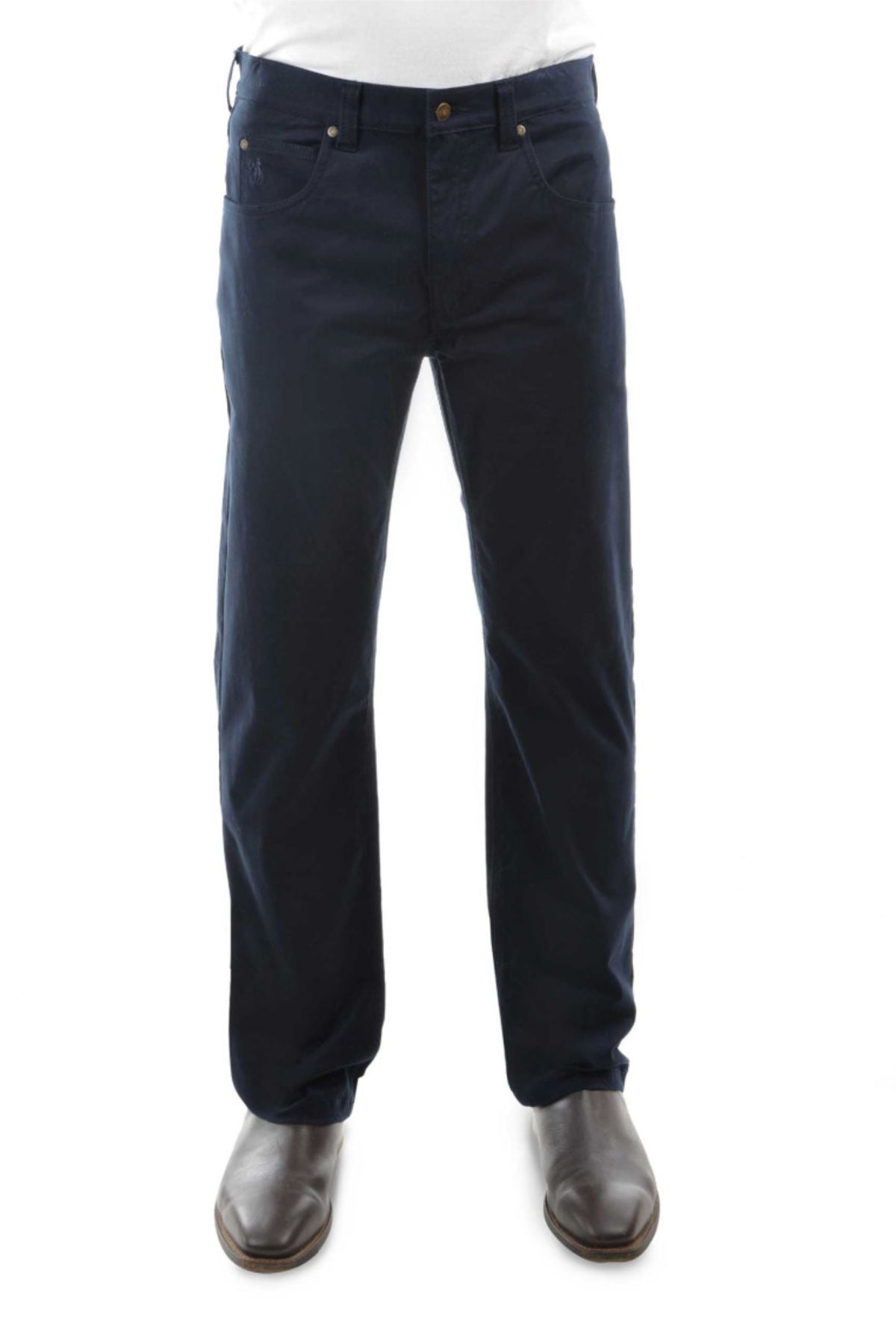 A person wearing Thomas Cook Jake Comfort Waist Jeans in dark blue with brown shoes, shown from the waist down against a white background.