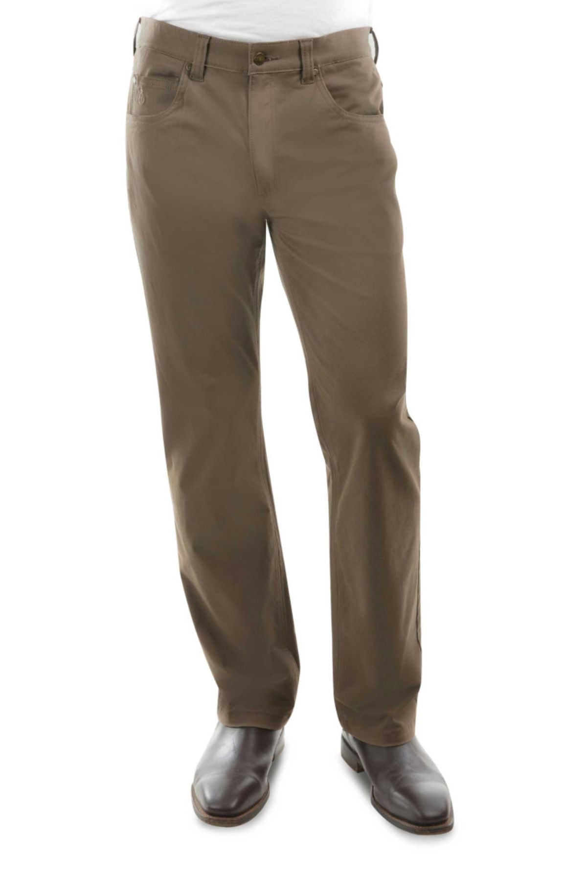 Man wearing brown Thomas Cook Jake Comfort Waist Jeans and dark brown dress shoes, standing against a white background. The stretch fabric jeans feature front and coin pockets, offering both style and comfort. Lower half of body is visible.