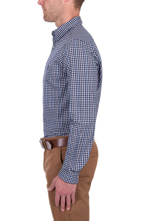 A man in profile against a white background wears the Thomas Cook Jason Tailored Shirt, featuring blue and white checks, paired with a brown belt and khaki pants.