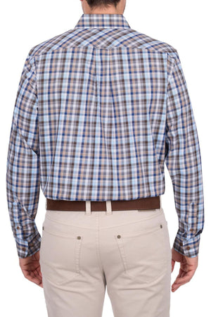 A person is seen from the back wearing the Thomas Cook Jonathan Shirt—a long-sleeved, 100% cotton shirt with blue, brown, and white plaid—paired with light beige pants and a brown belt.