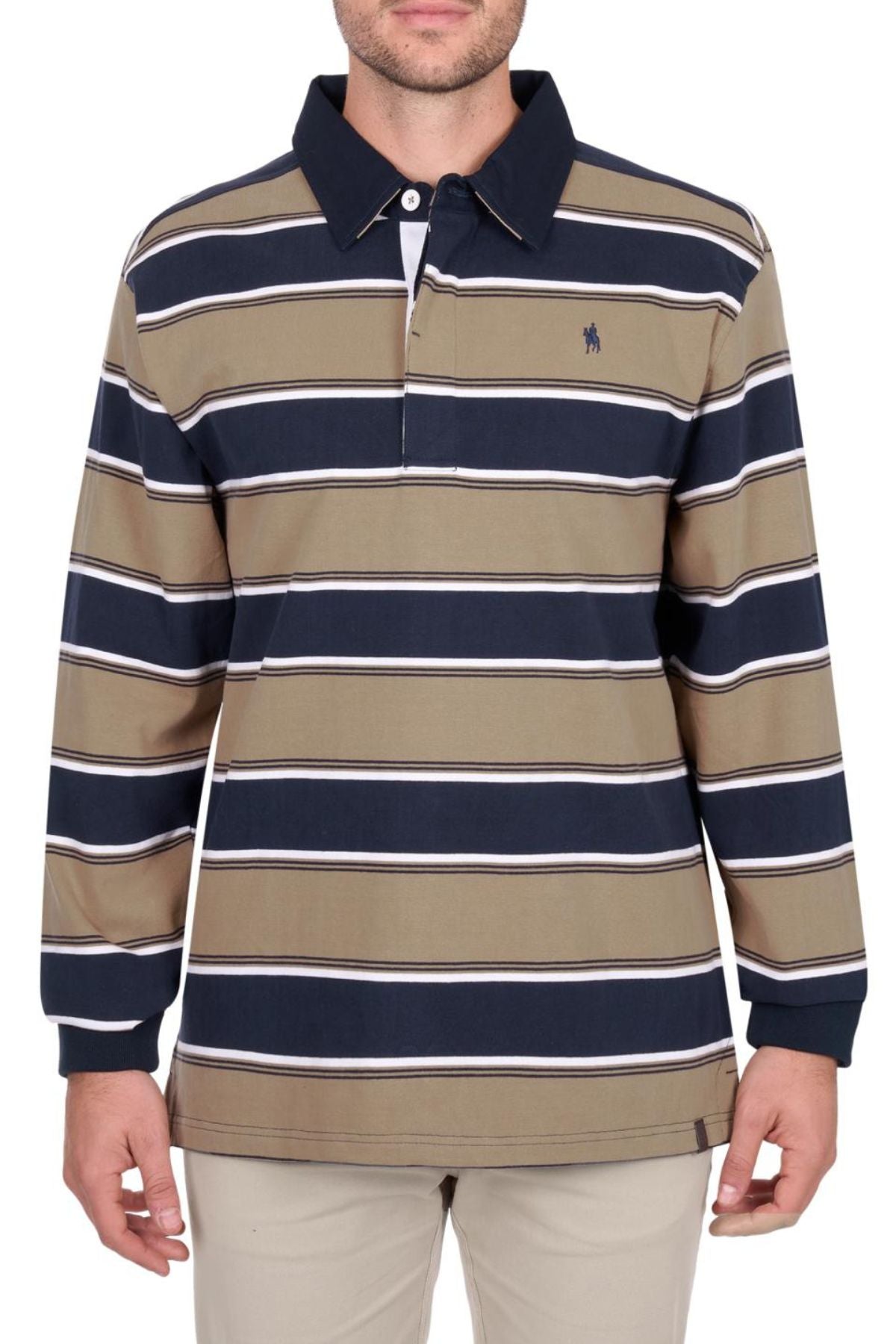 A man wears the Thomas Cook Jose Rugby heavyweight cotton jersey shirt with horizontal navy, tan, and white stripes, a navy collar, beige pants, and a small embroidered logo on the left chest.