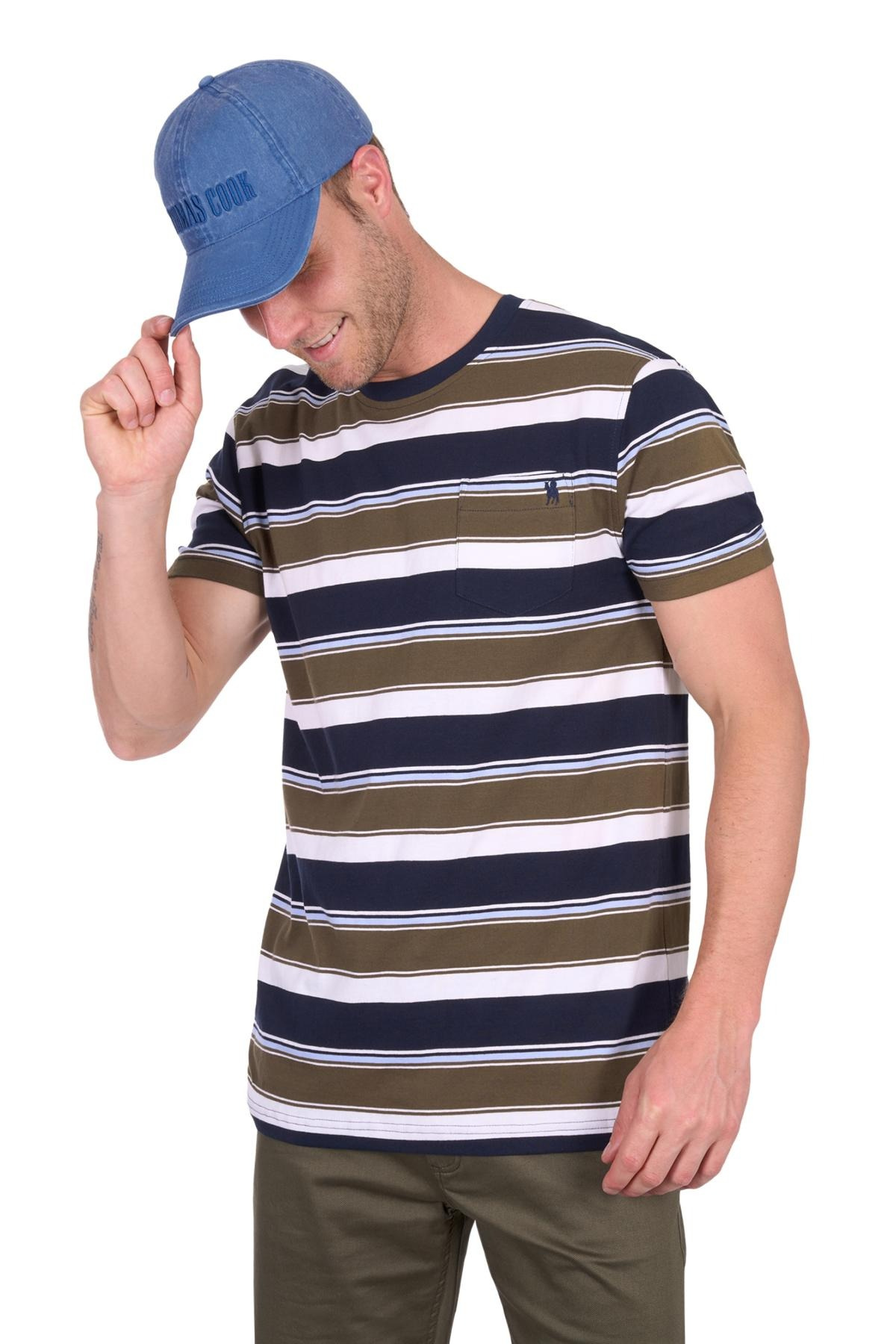A man in a blue cap, olive pants, and the Thomas Cook Keith Stripe Tee—featuring multicolour stripes and subtle horseman embroidery—smiles while tilting his cap against a white background.