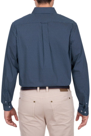 A person is seen from the back wearing a navy blue Thomas Cook Kevin Shirt, a men's patterned long sleeve cotton shirt, paired with light beige pants.