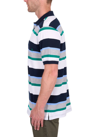 A man in profile wears the Thomas Cook Paul Polo—short-sleeved cotton pique with navy blue, green, gray, and white horizontal stripes—paired with olive green pants against a plain white background.