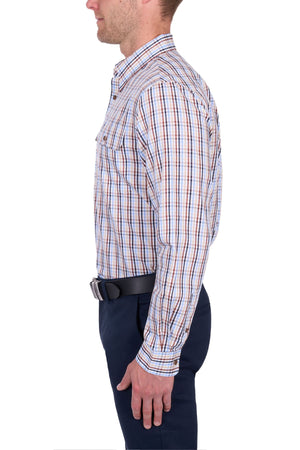 A man wears the Thomas Cook Scott Shirt, a 100% cotton, long sleeve plaid shirt, with dark pants and a black belt. He stands in profile against a white background with his arms relaxed at his sides.