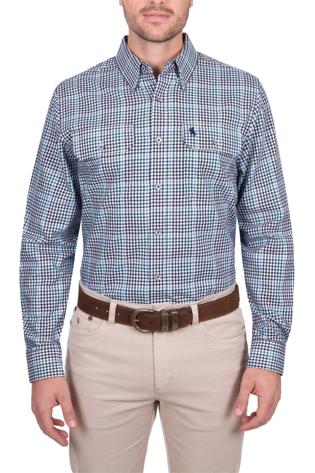 A man wearing the Thomas Cook Stephen Shirt, a blue and white checked 100% cotton men's work shirt, with tan pants and a brown belt stands against a white background.