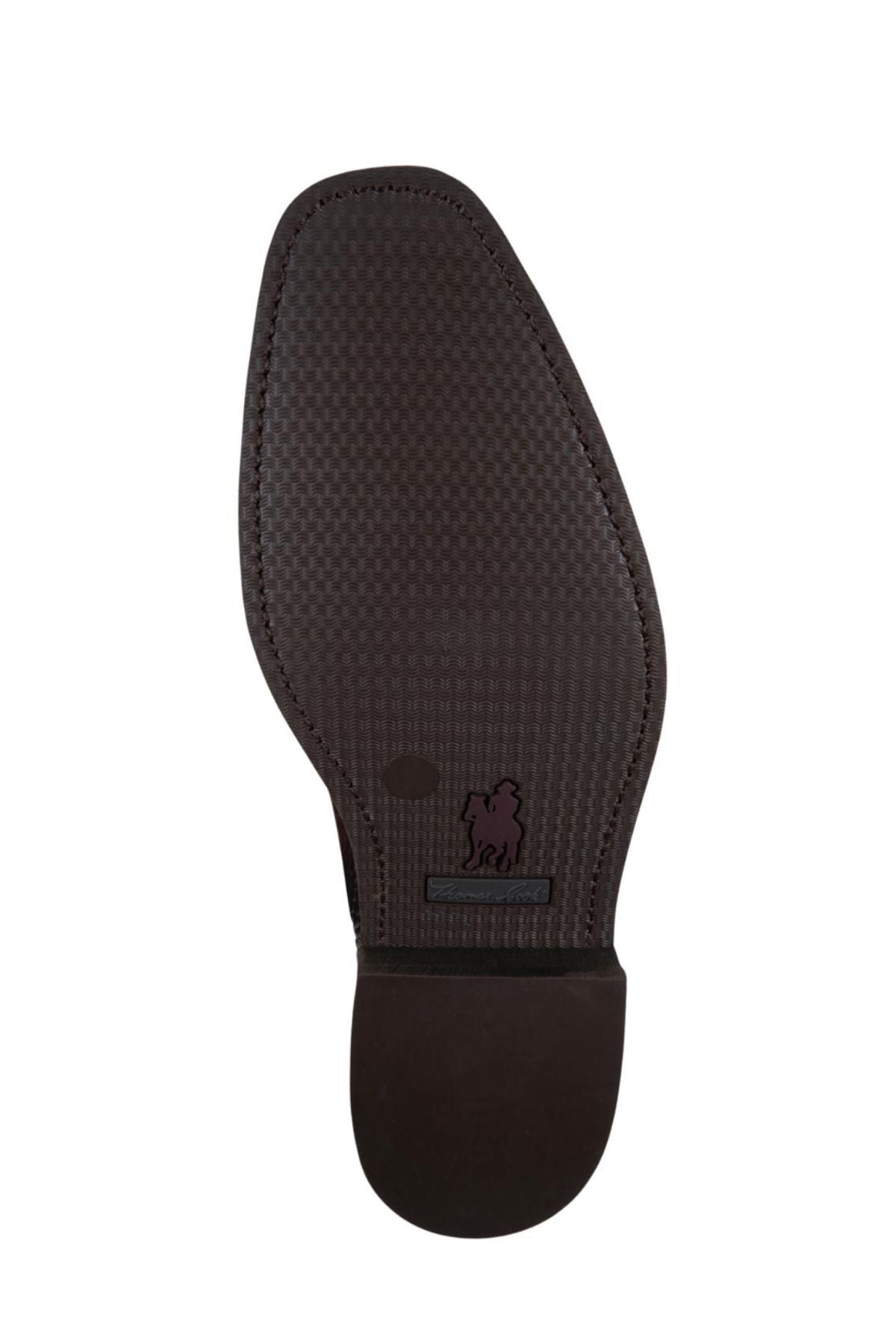 The image shows the sole of the Thomas Cook Trentham Cushion Tech Dress Boot, made from premium brown leather with a textured pattern and a small embossed lion logo near the heel.