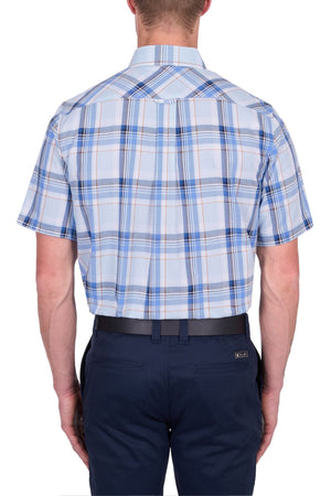 A man is shown from the back wearing the Thomas Cook Brian Short Sleeve Shirt in light blue 100% cotton with a blue, white, and beige plaid pattern, paired with dark blue pants and a belt—ideal for everyday wear.
