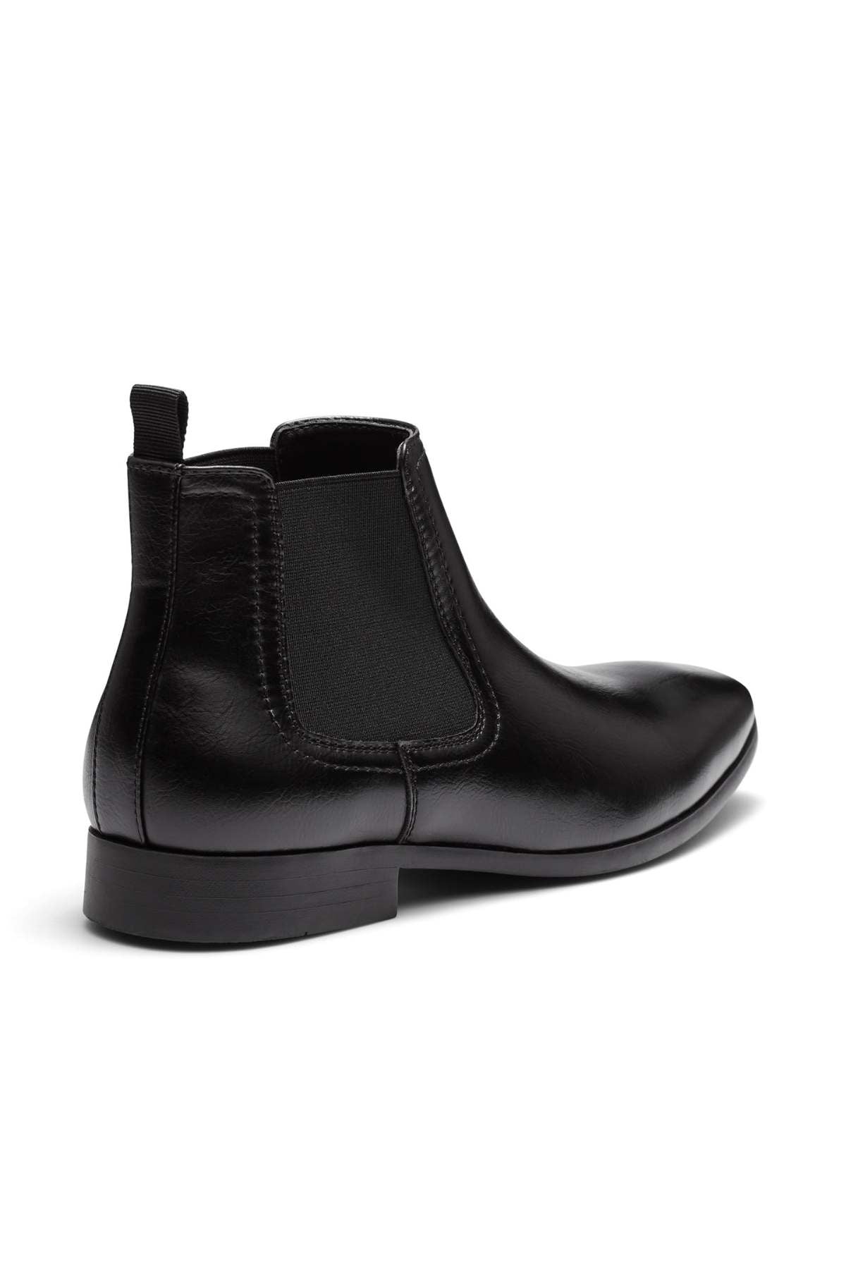 Introducing the UNcut Newlands Boot: a versatile black leather ankle boot designed with an almond toe shape. This stylish footwear features an elastic side panel and a convenient pull-tab at the heel. With its low heel and smooth finish, it's perfect for pairing with both formal and casual attire. Available in UK sizing to ensure a perfect fit.