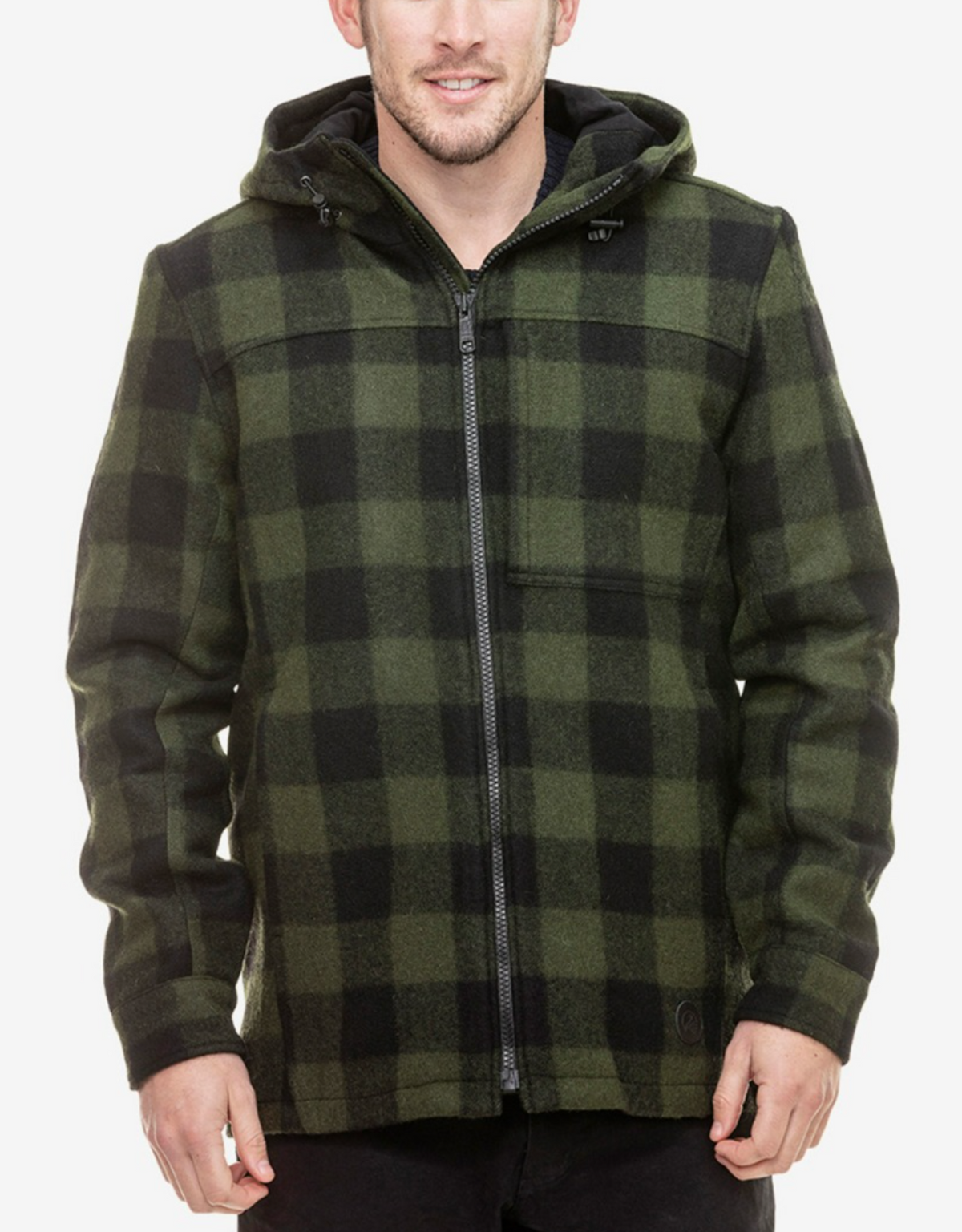 A person wearing a green and black checkered Swanndri Hudson Hoody stands against a plain white background. Made from New Zealand wool, the warm hoody features a front zipper and a chest pocket. The person's face is partially out of frame.