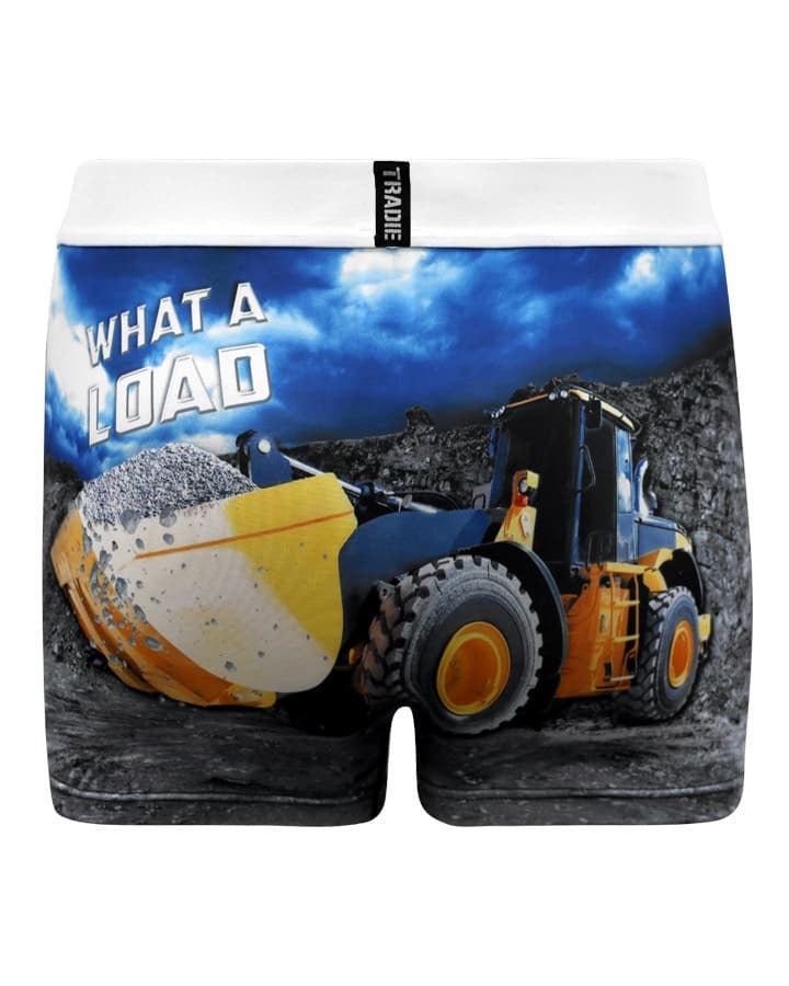 Tradie Mens Work N Surf Trunk: Rugged men’s boxer briefs showcasing a bold yellow front-end loader dumping gravel, with “WHAT A LOAD” in white against a dramatic sky and rocky backdrop.