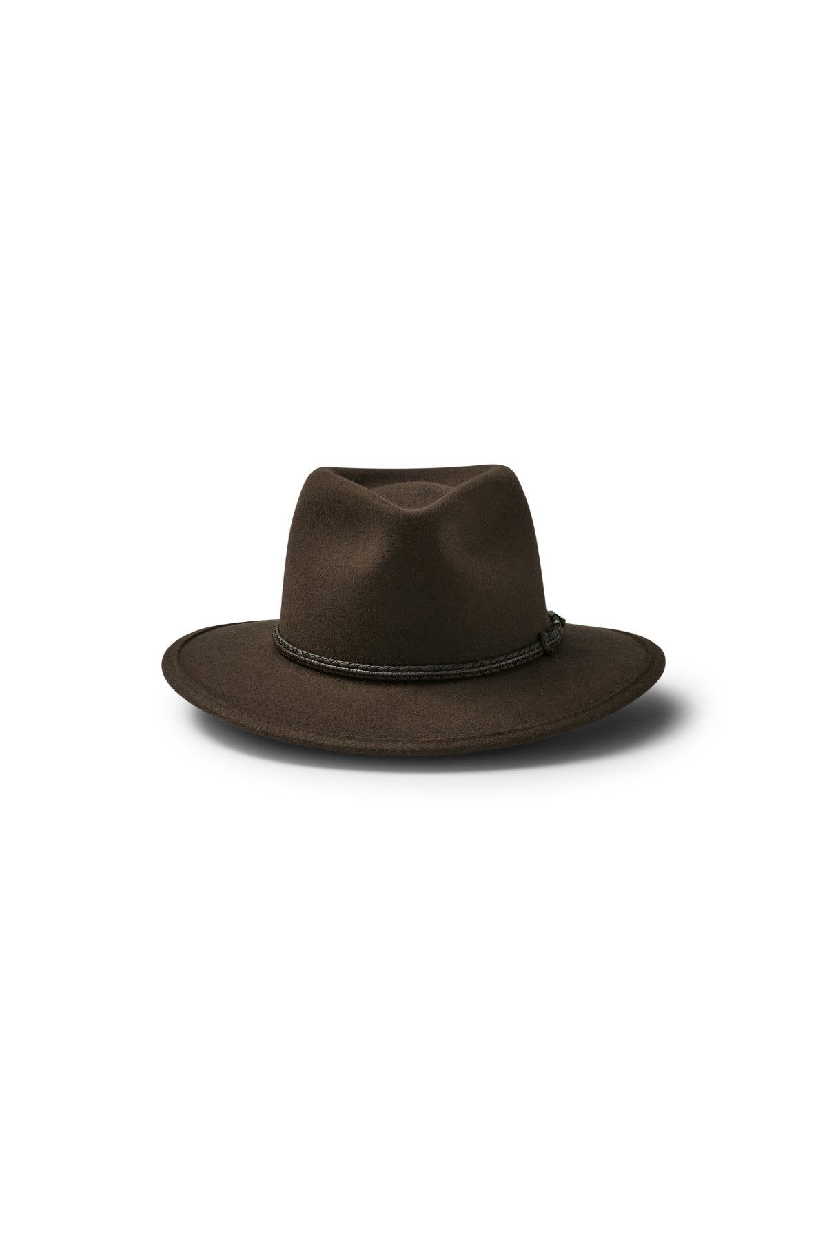 The Akubra Traveller is a dark brown felt hat featuring a wide brim and a thin black braided band, shown on a white background with a soft shadow underneath.