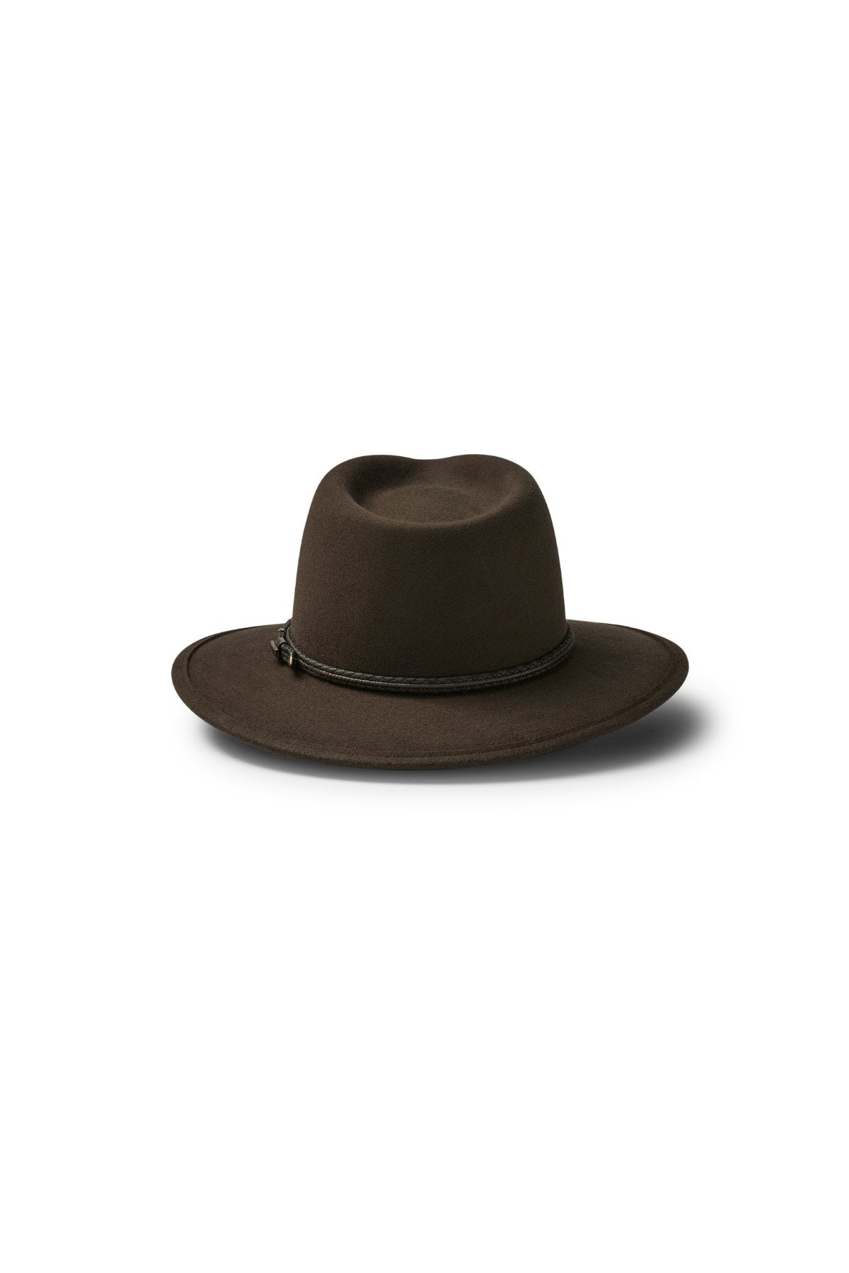 The Akubra Traveller is a dark brown, wide-brimmed felt fedora with a simple braided band around the crown, shown on a white background with a soft shadow.