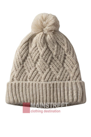 The Anticorp Ladies Herringbone Beanie is beige with a textured herringbone pattern, folded brim, and large pom-pom. "MAINSTREET clothing destination" is featured at the bottom.