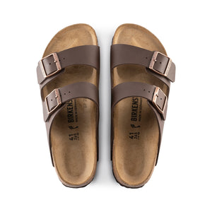 A pair of Birkenstock Arizona Birko-Flor Regular sandals in brown, featuring two adjustable straps with metal buckles, a contoured cork-latex footbed, and cork soles for comfort and support, shown from above on a white background.