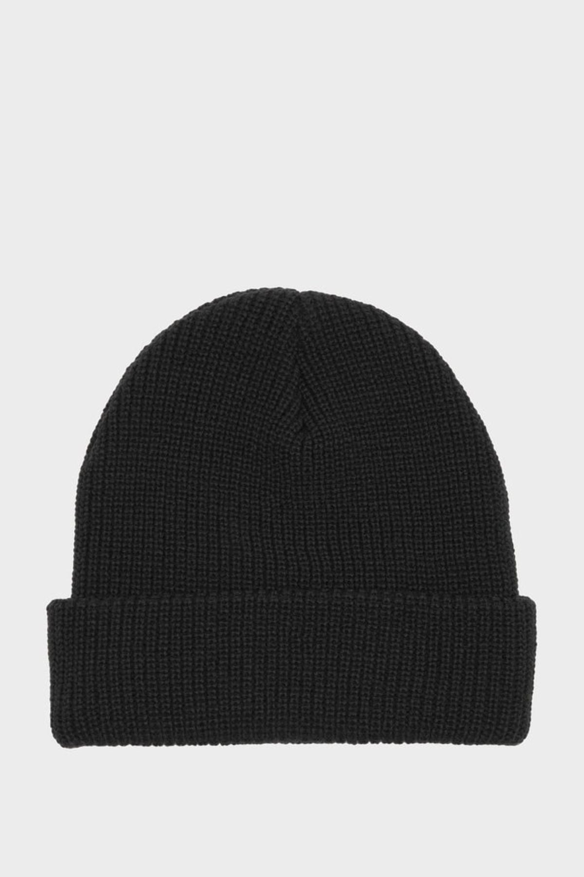 The Billabong Arcade Beanie is a plain black hat with a folded brim, made from acrylic gauge rib knit in a classic Skull Fit, shown against a light gray background.