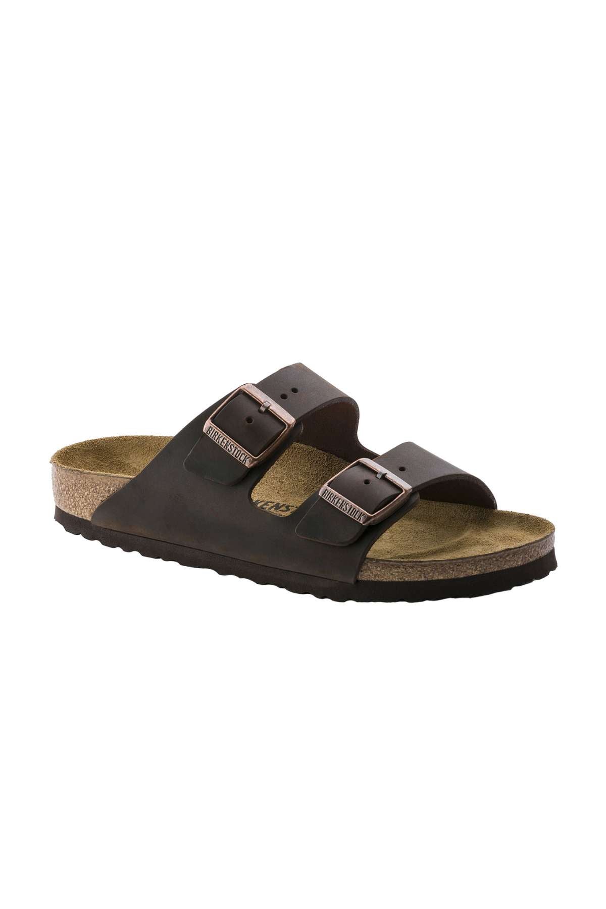 A single black Birkenstock Arizona sandal featuring two adjustable straps with silver buckles, a cork footbed, and a black rubber sole. The sandal is angled to the right, displaying a side perspective.