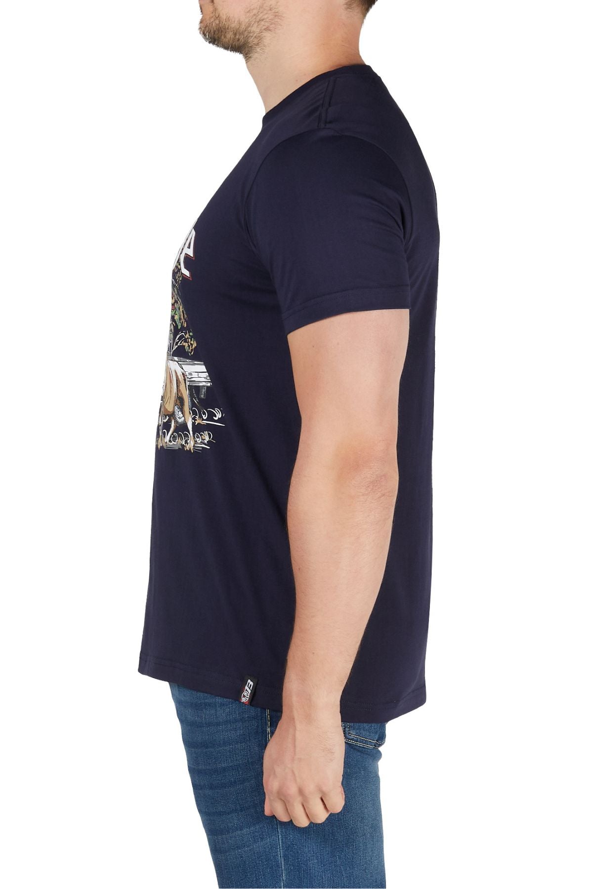 A man stands in profile wearing the Bullzye Dusk Tee and blue jeans, arms relaxed by his sides, against a plain white background.