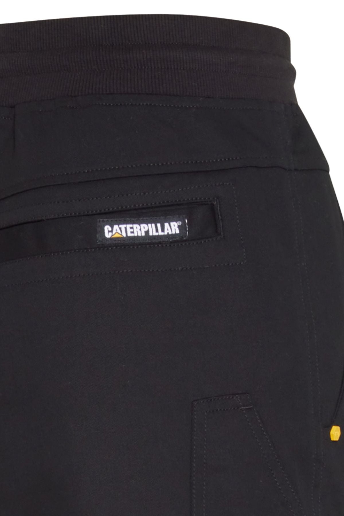 Close-up of the back pocket on CAT Diesel Short 2.0, featuring a "Caterpillar" label above the pocket. The image shows the waistband and stitching details, highlighting the durability of these black stretch ripstop work shorts.