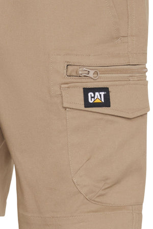 Close-up of a khaki pocket on the CAT Diesel Short 2.0, featuring a zippered compartment and "CAT" logo patch above a yellow triangle—these work shorts are made from durable stretch ripstop fabric.