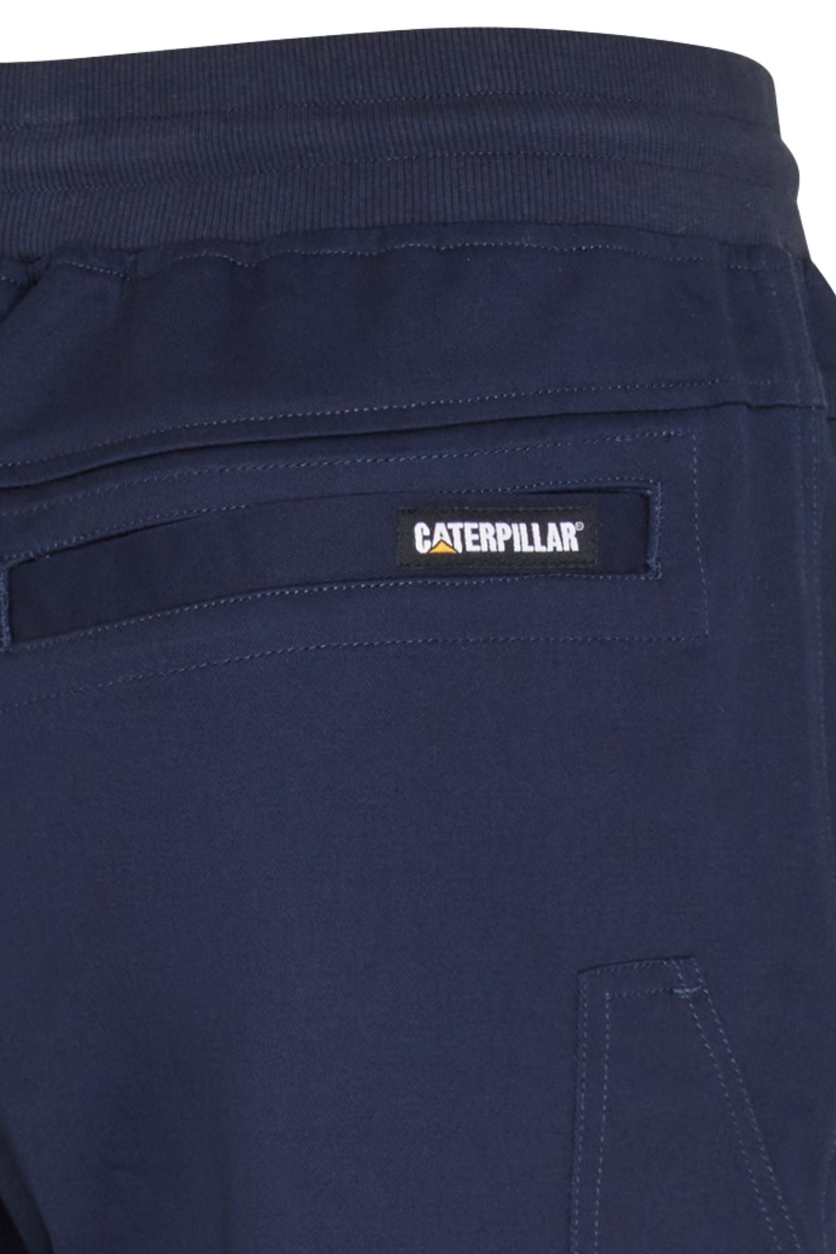Close-up of the back pocket on navy blue CAT Diesel Short 2.0, showing a rectangular Caterpillar label above the pocket.