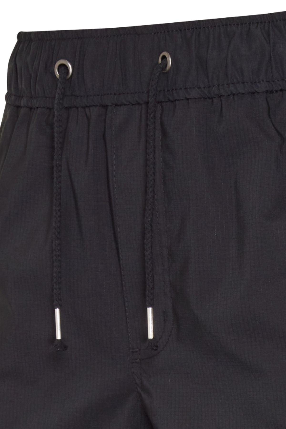 Close-up of the CAT Hydraulic Short waistband, featuring an elastic drawstring with metal tips, two metal-reinforced eyelets, and subtly textured fabric.