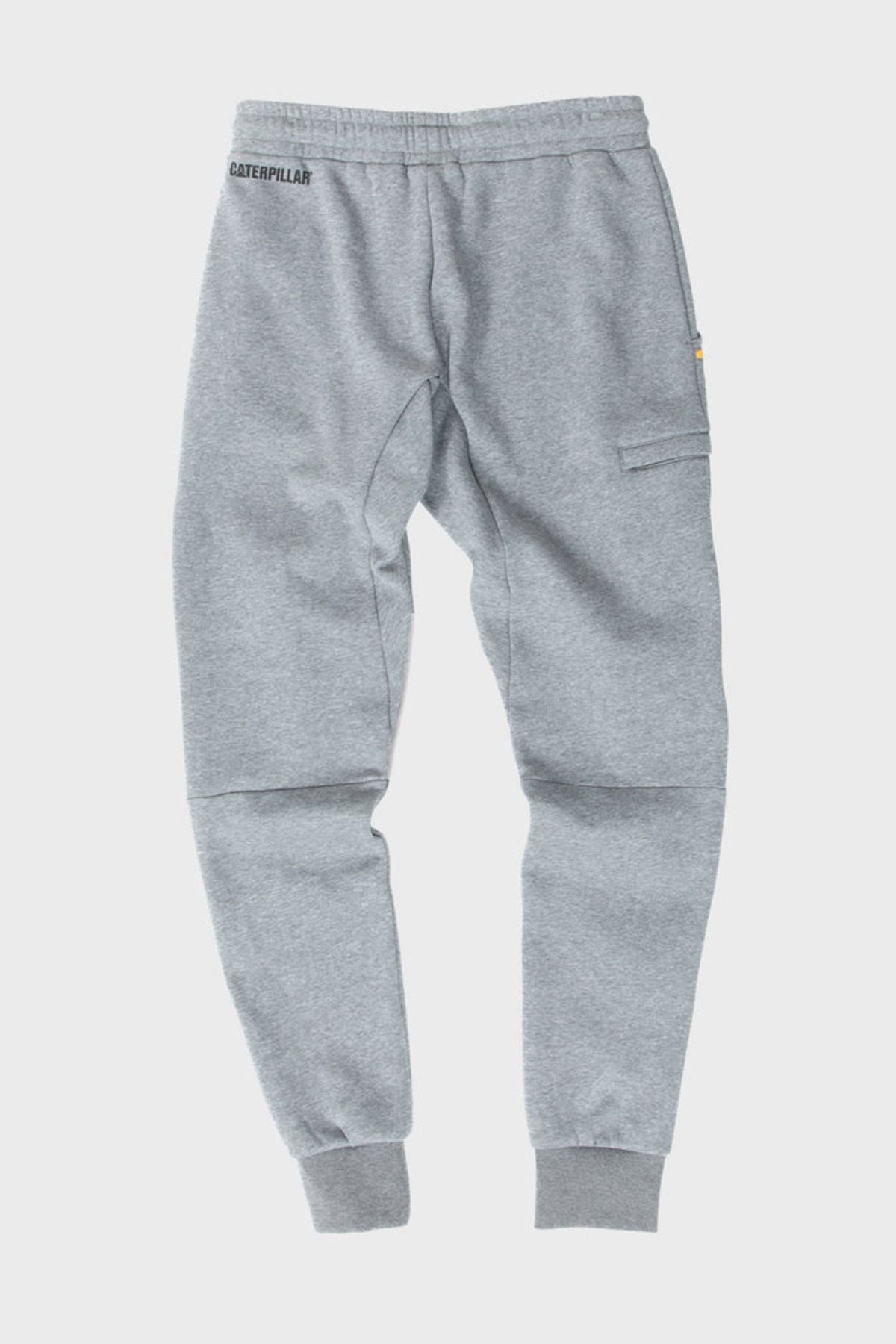 The CAT TM Fleece Track Pant in light gray features a tapered fit, elastic waistband and cuffs, side zipper pocket, and small CAT branding on the left hip, displayed flat on a plain white background.