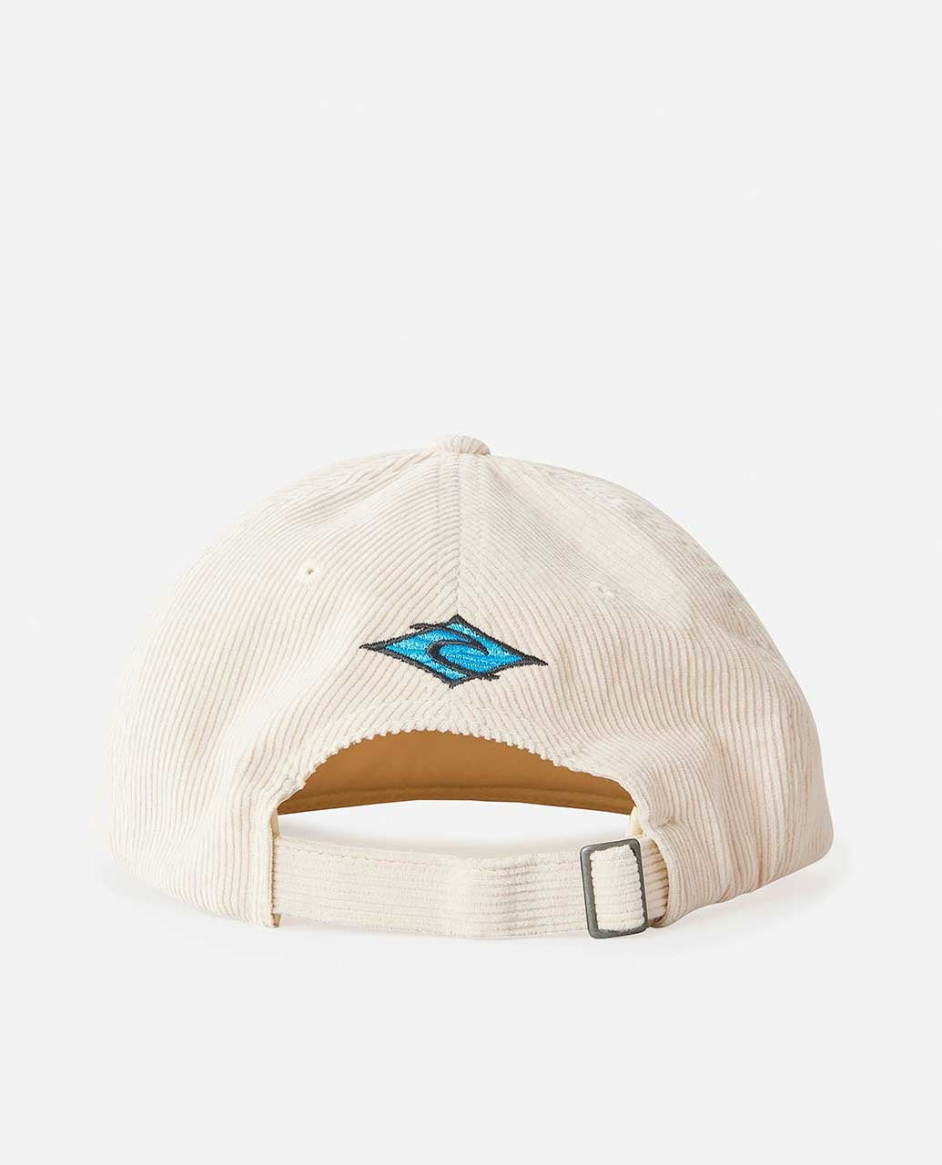 The Rip Curl Diamond Adj Cap is crafted from soft corduroy in cream, featuring an adjustable strap with a metal buckle for a perfect fit and a small blue and turquoise embroidered logo near the back.
