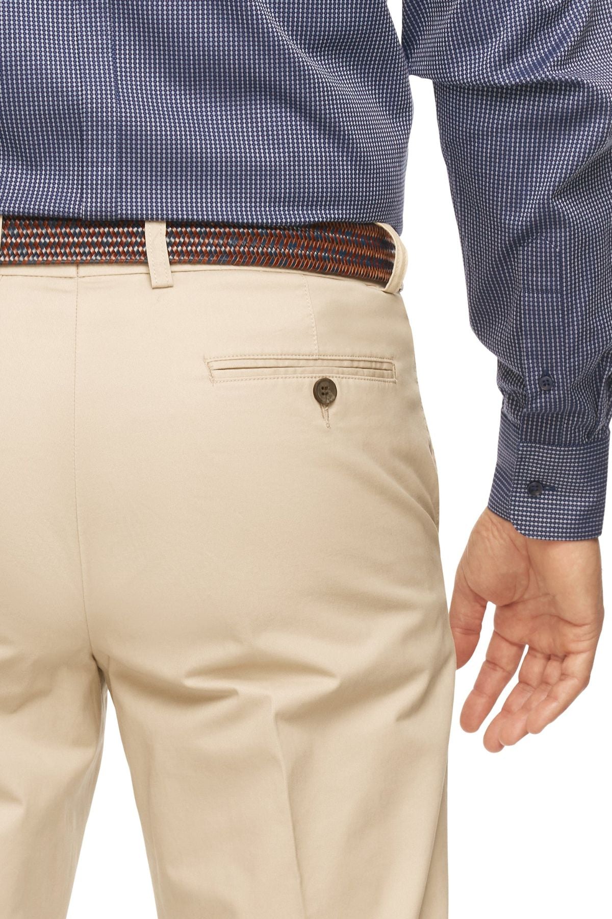 A person is shown from behind, wearing a blue checkered long-sleeve shirt and beige City Club Mariner Harbour Pants with a multicolored woven belt. The left hand is visible, hanging down by their side, and there is a buttoned pocket on the back of the comfortable Mariner Harbour Pants with elasticated sides.