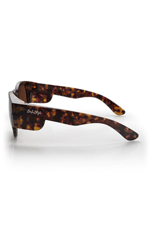 SafeStyle Cruisers Matte Brown Tort sunglasses feature thick, rectangular frames and brown polarised lenses with UV400 protection. "So Fetch" is written in white script on the temple arm. Shown from the side.