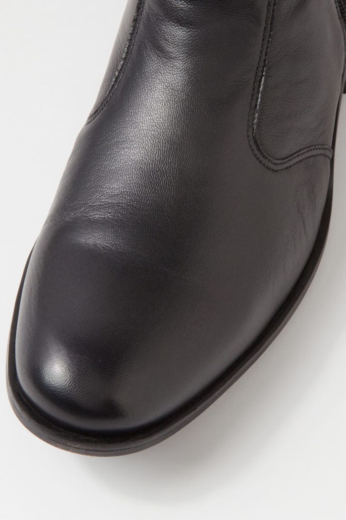 Close-up of the toe area of the Ferracini March Boot, made from black genuine leather with visible stitching, shown against a white background.
