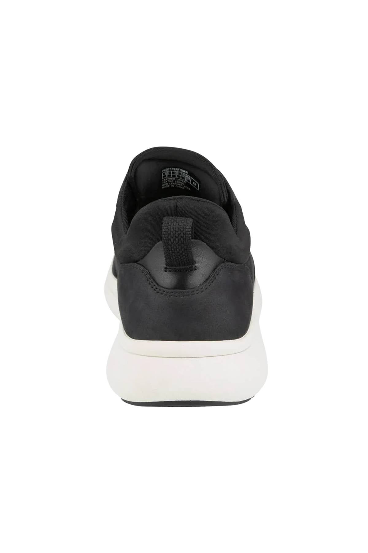 A rear view of the black Florsheim Fleet Perf Sneaker with a white sole, showcasing its SupaStep design at the heel, heel loop, and padded collar against a plain white background.