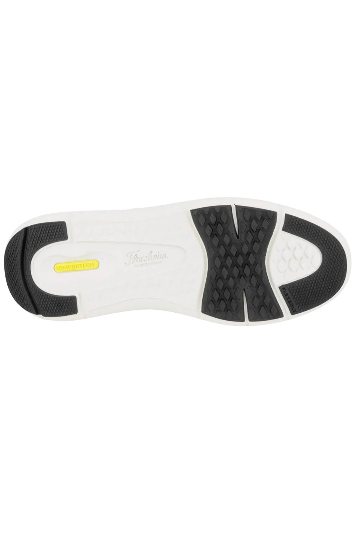 The Florsheim Fleet Perf Sneaker features a white sole with black tread at the toe and heel, a textured grip pattern in the center, and a yellow "Vibram" logo on the side, showcasing its SupaStep design.