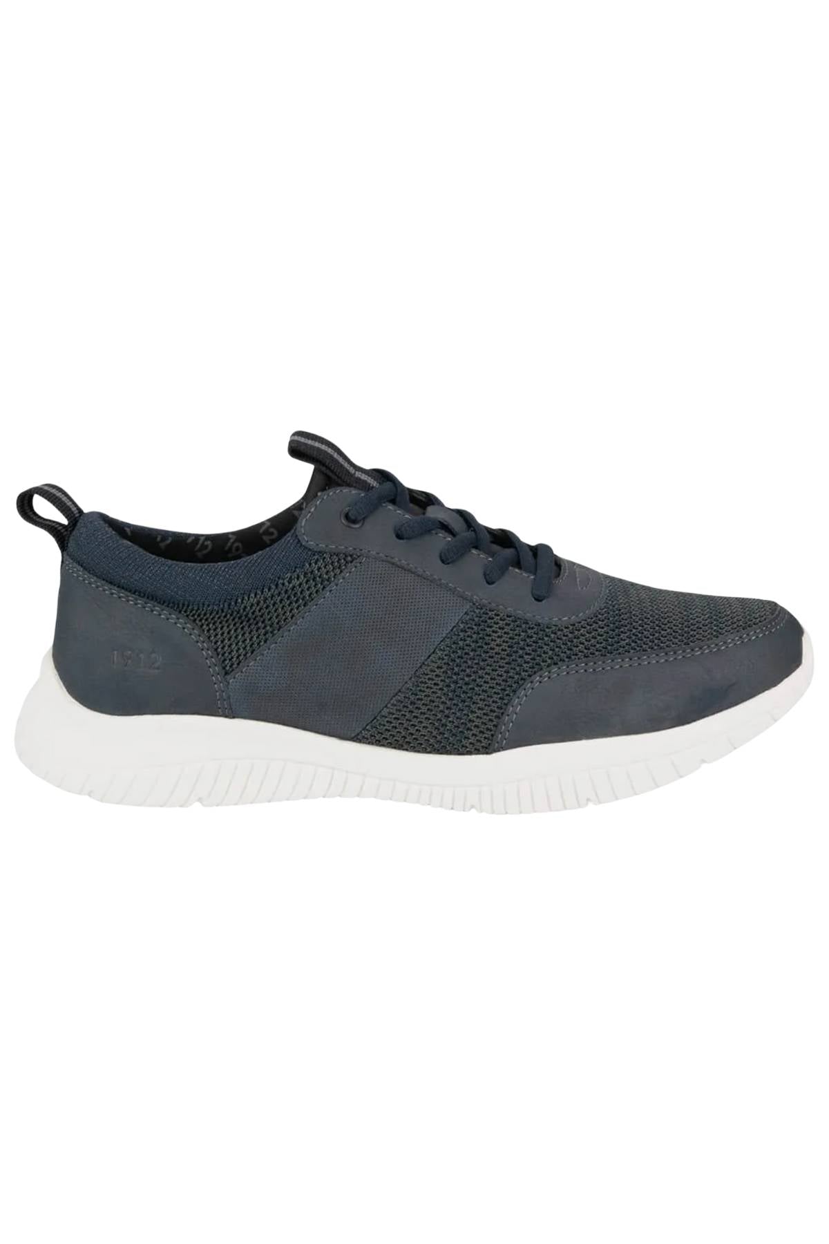 The Florsheim Kore City Pass Sneaker, shown in side profile on a white background, features a dark gray mesh and synthetic upper, white sole, lace-up closure, Comfort Gel heel pod, and a pull tab at the heel.
