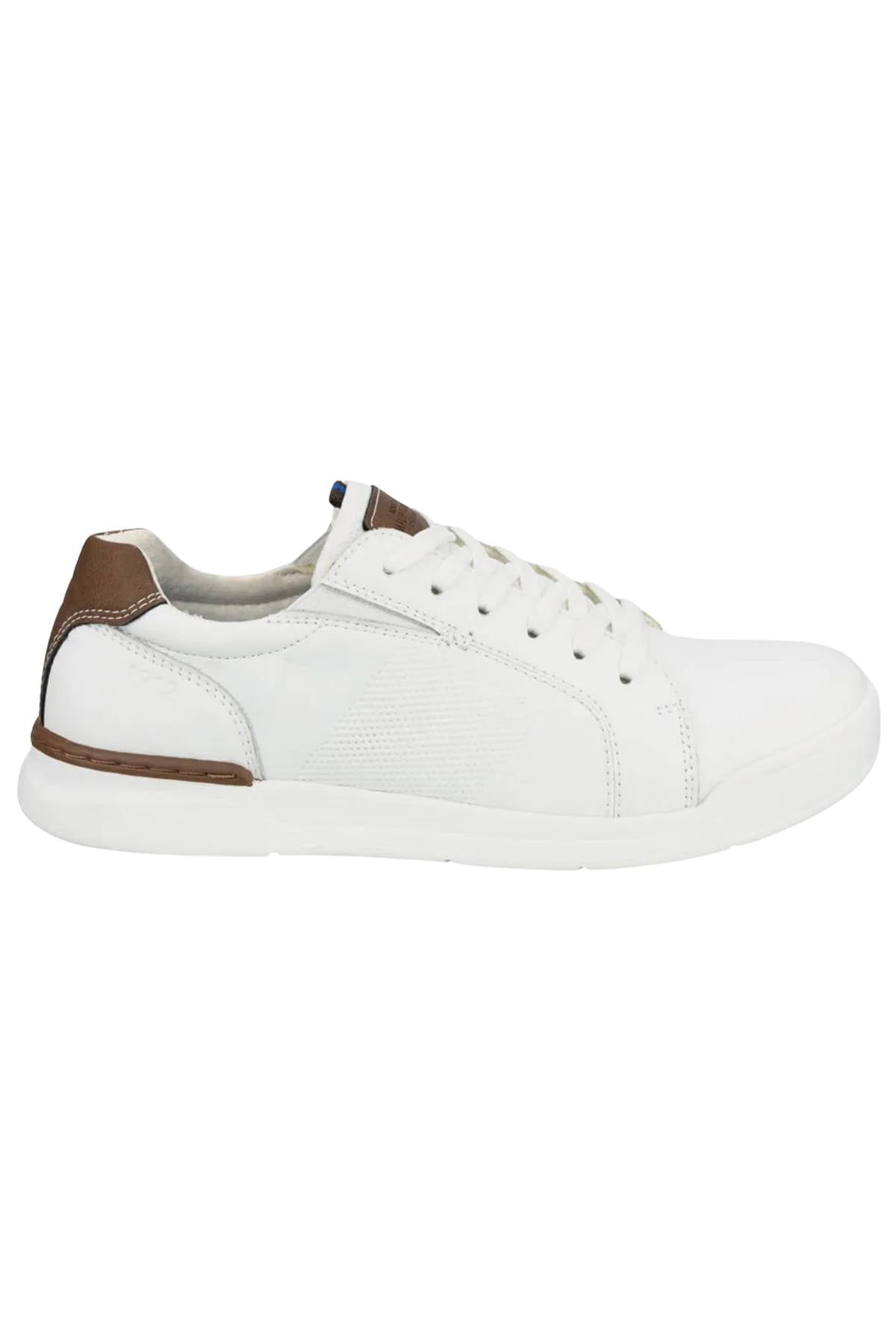The Florsheim Kore Tour Lace Sneaker is a white low-top with textured side panels, genuine leather, white laces, and brown accents on the heel and tongue. It features a lightweight EVA sole and is shown in left side profile view.
